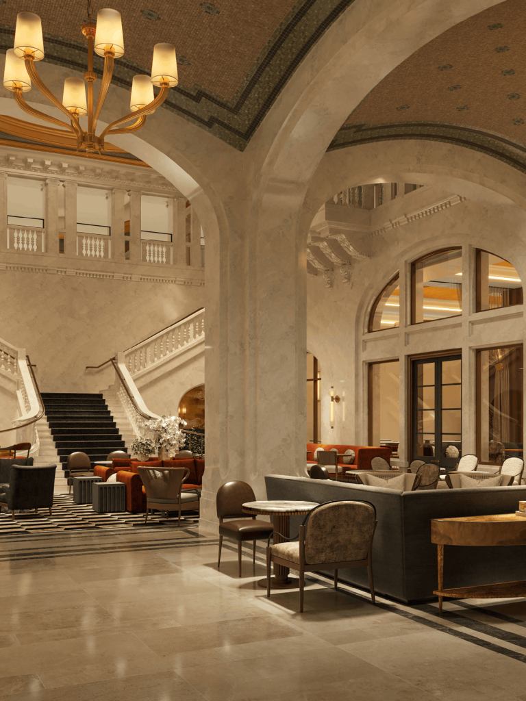 A grand hotel lobby features multiple plush seating areas and a sweeping staircase, within an opulent, high-ceilinged interior with chandeliers and mosaic-patterned arches.