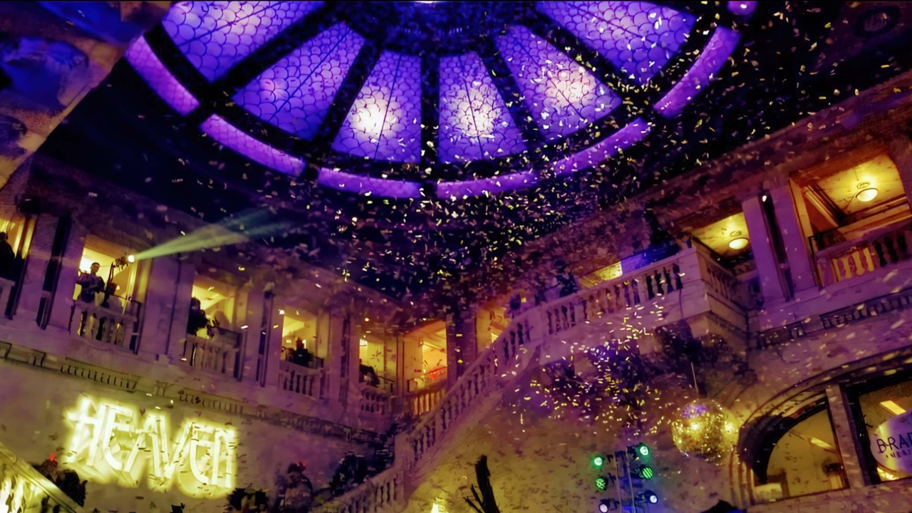 Confetti falls from above in a hotel lobby