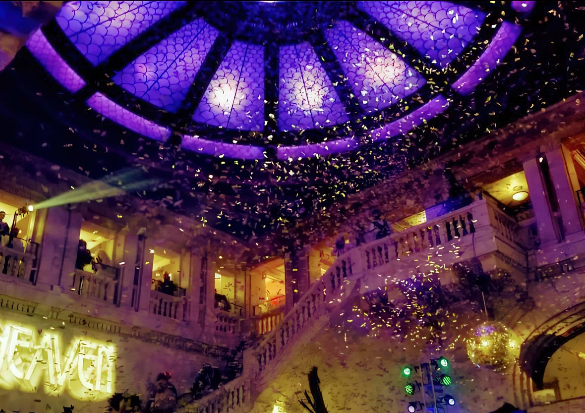 Confetti falls from above in a hotel lobby