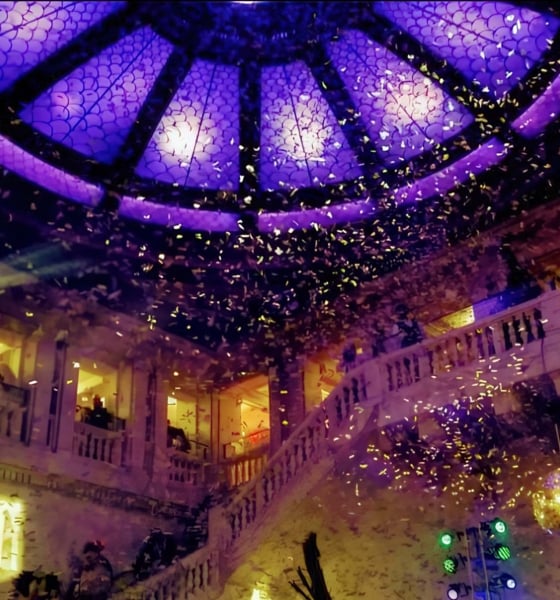Confetti falls from above in a hotel lobby