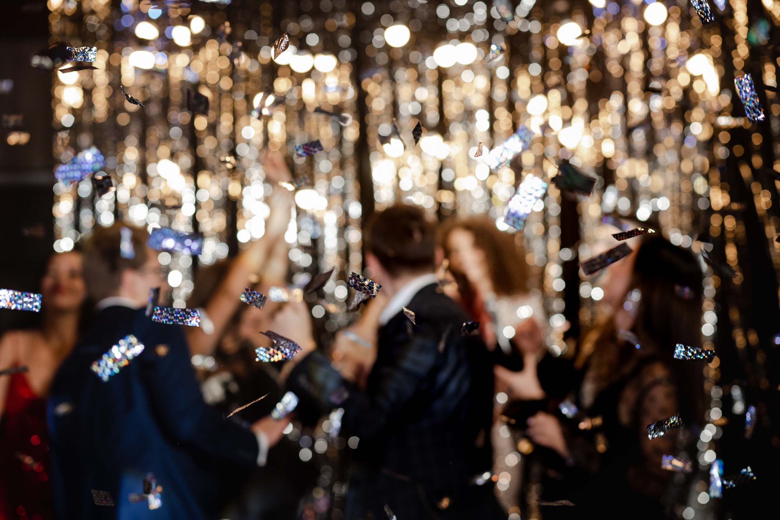 Confetti falling over a group at a party