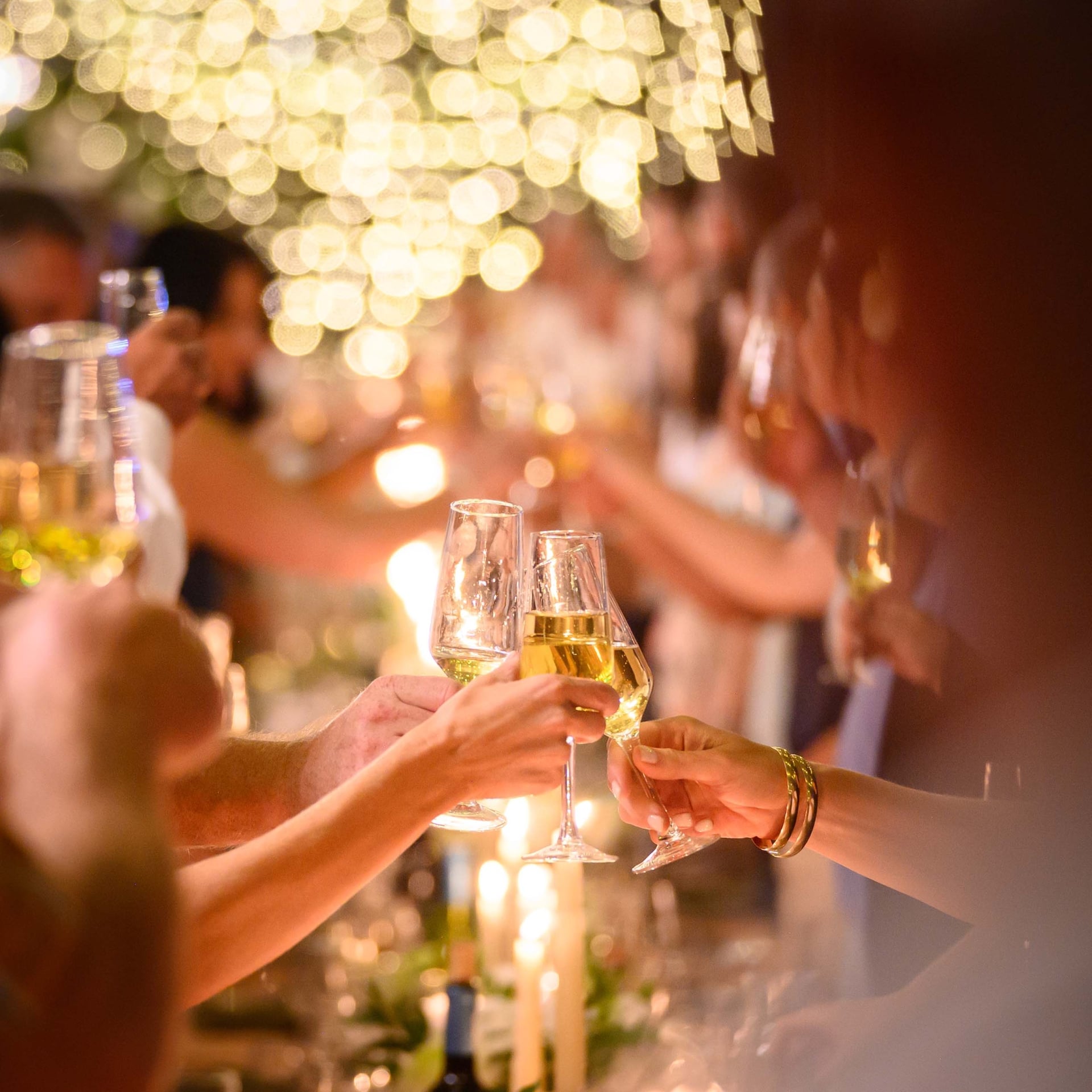 A group clinking champagne glasses at an event