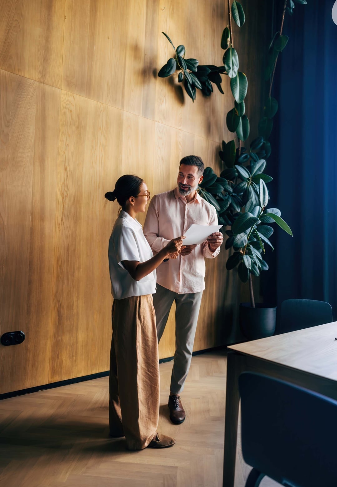 Two professionals meeting in a workspace