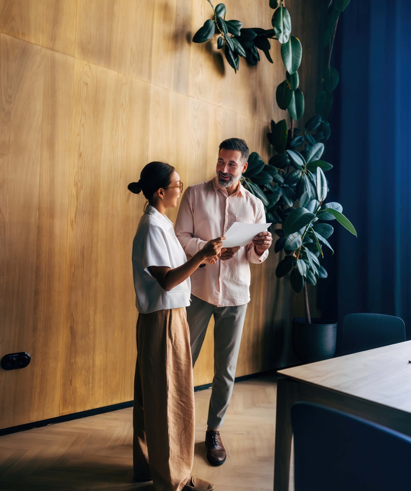 Two professionals meeting in a workspace