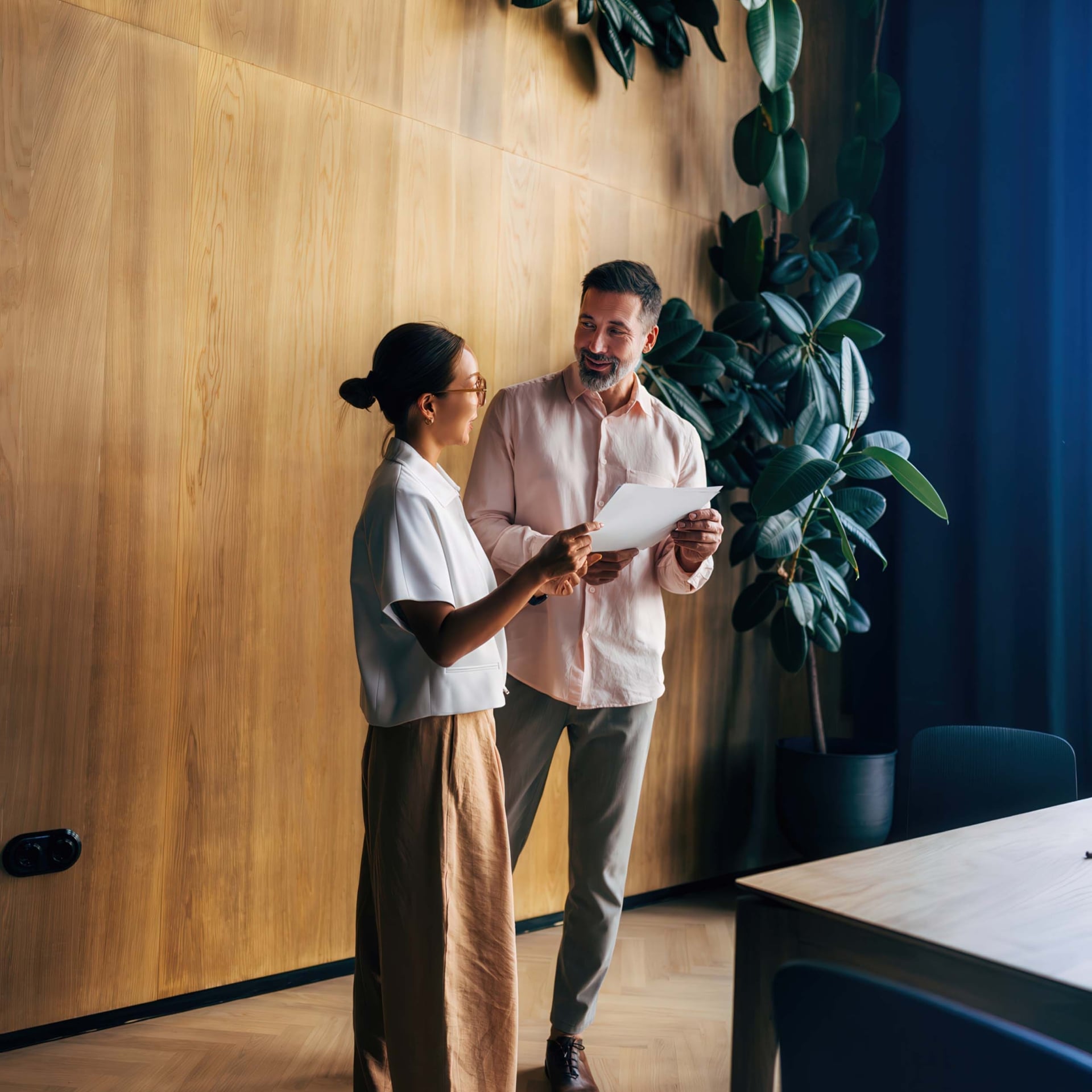 Two professionals meeting in a workspace