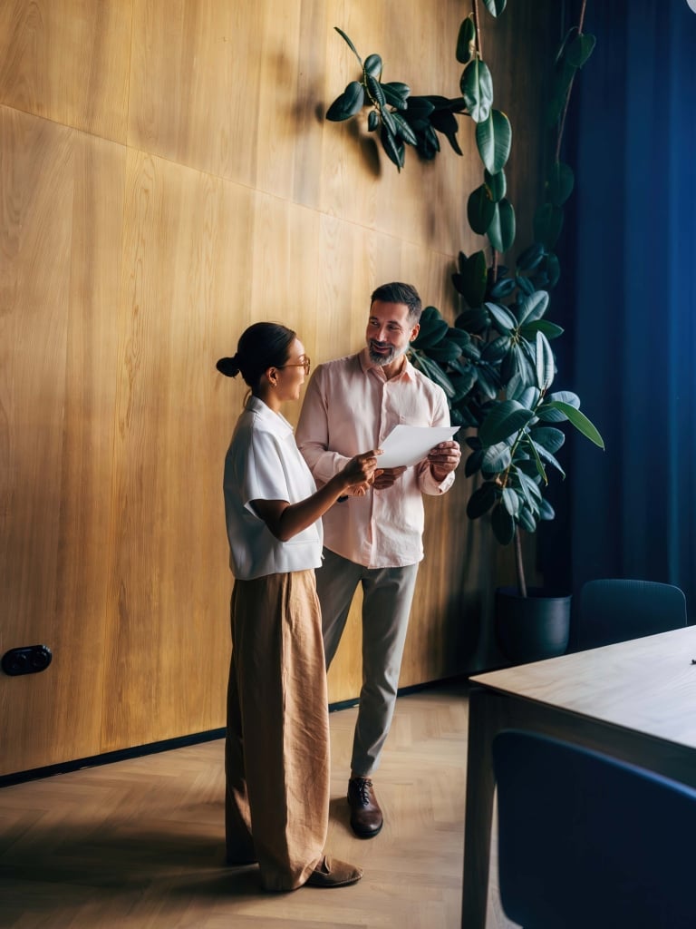 Two professionals meeting in a workspace