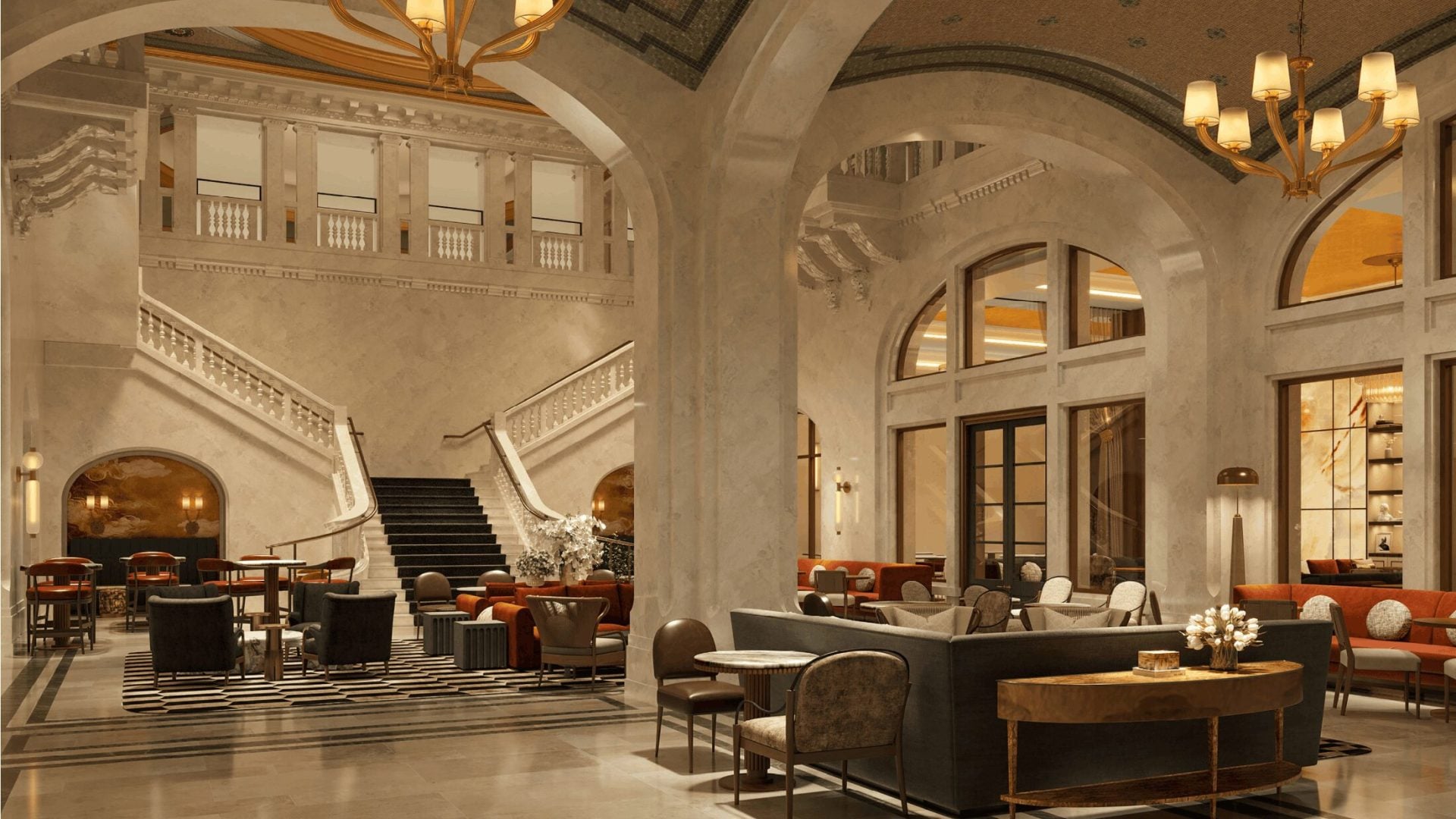 Elegant hotel lobby with arched walls, marble staircase, and warm chandeliers